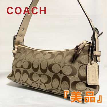 Brand new COACH signature accessory pouch handbag.