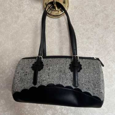 Gray and black handbag.