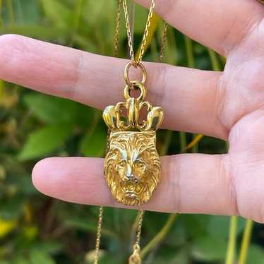 Anne Klein lions head gold tone pendant and brand 