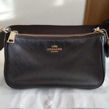 Brand new black mini COACH bag.