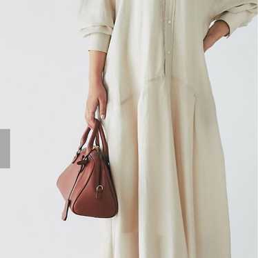 Cream-colored maxi dress with balloon sleeves.