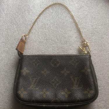 Louis Vuitton accessory pouch.