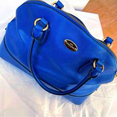 A rare and beautiful blue old Coach handbag.