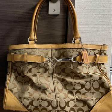 Coach handbag with storage bag.