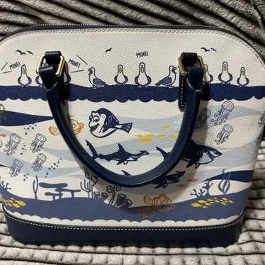 EUC Disney Dooney fashion and Bourke Passport Cr