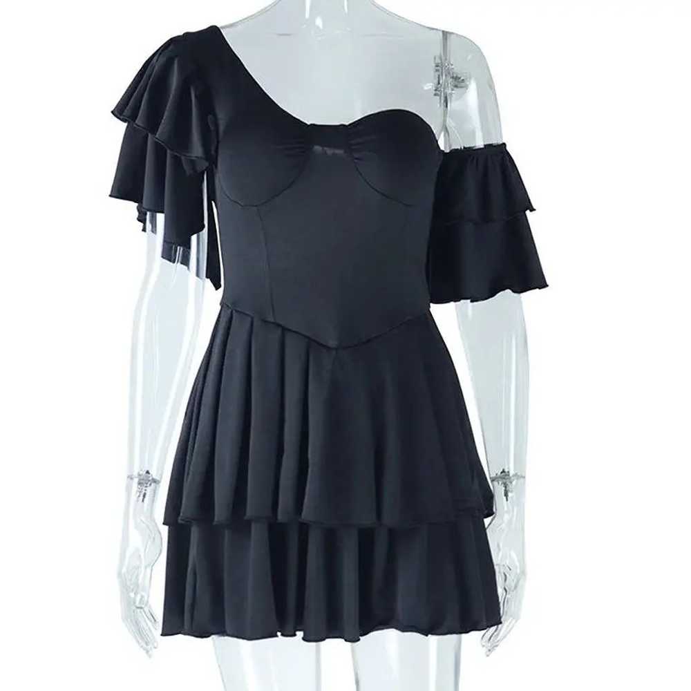 Dress with irregular sloping collar - image 1