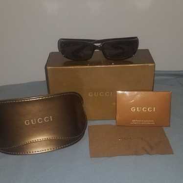 authenticated Gucci sunglasses & case - image 1