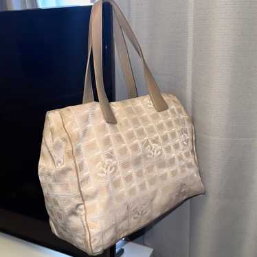 Beige Chanel travel line tote