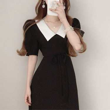 Black balloon sleeve dress.