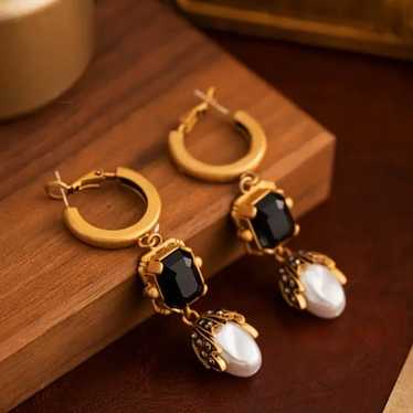 A pair of luxurious vintage drop pearl earrings