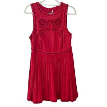 Free People red dress with embroidered details.