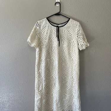 Halogen cream and black lace dress