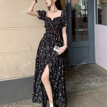 Flower-patterned short-sleeve long dress in black.