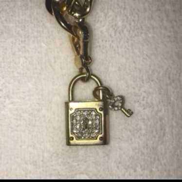 A Juicy Couture lock and key charm