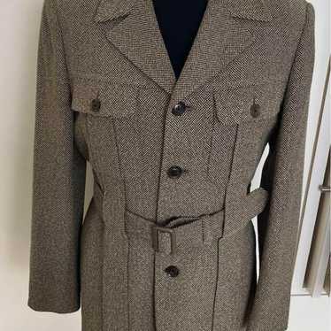 Norfolk jacket tweed with waist belt.