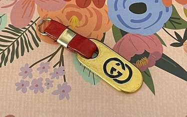 Gucci gold toned zipper - Gem