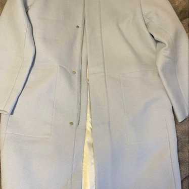 Light blue long coat, size 36, like new.