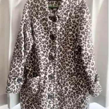 Leopard coat in white, black, and gray.