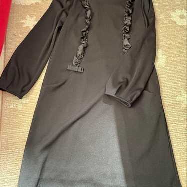 Long-sleeved formal dress.