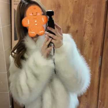 White unreal faux fur coat