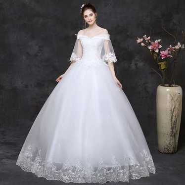 White off-the-shoulder wedding dress