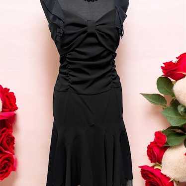 Elegant black dress with ruffles.