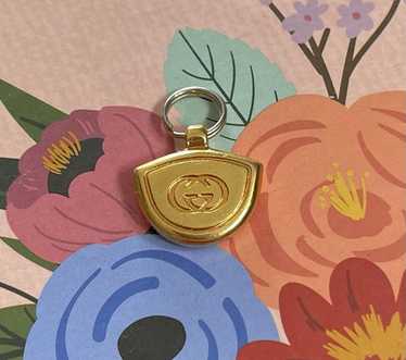 Gucci gold toned zipper - Gem