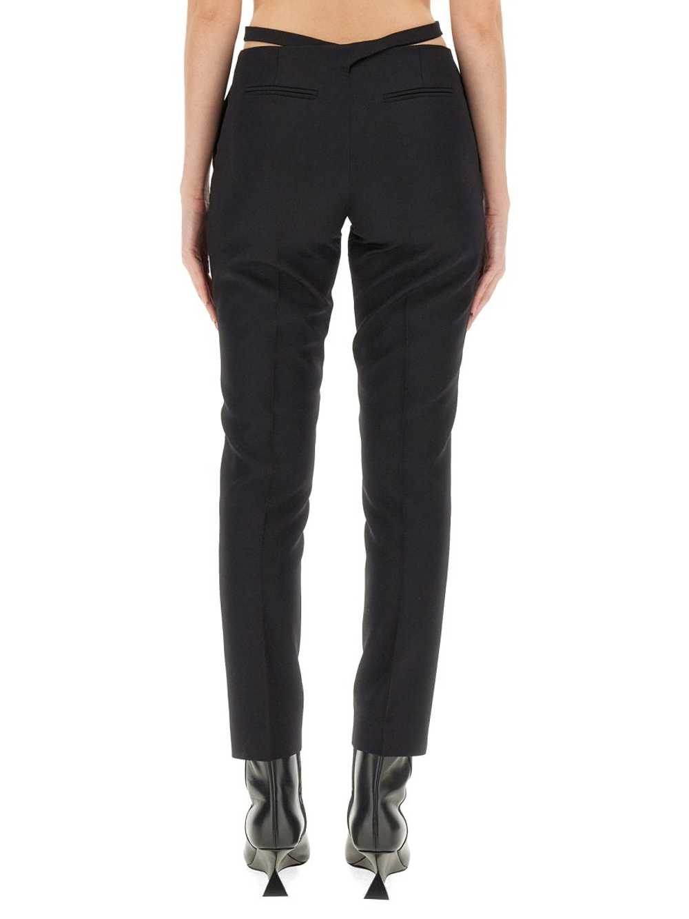 パンツ THE ATTICO SS24 CUT OUT PANTS (241WCP167_W046100) Cutout jersey flared pants in black - The Attico | Mytheresa