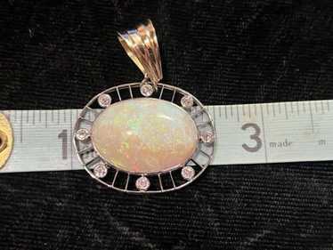 Opal And Diamond Pendant. Opal Approximately 31.2 