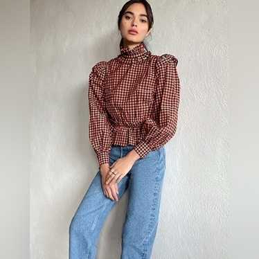 【Ganni】チェック seersucker peplumトップ Checked seersucker peplum top in black - Ganni | Mytheresa