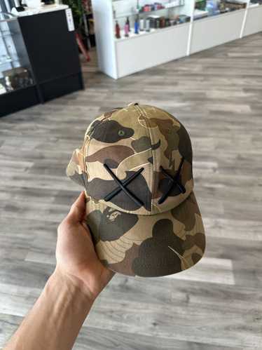 bape  kaws コラボキャップ　apee APE × KAWS コラボキャップ カモフラ柄 迷彩 - メルカリ