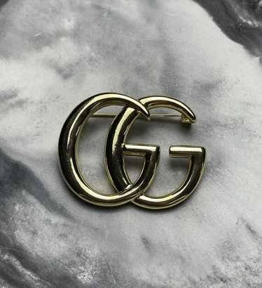 GUCCI GGロゴ ブローチ Double G crystal flower brooch in antique gold-toned metal