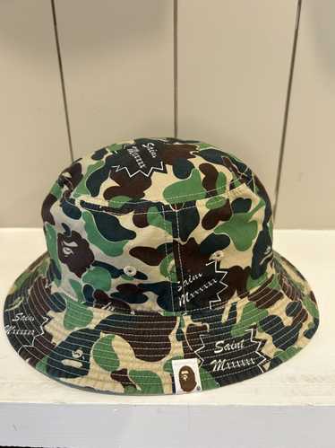 帽子 SAINT MICHAEL AP_BUCKET HAT ST APE CAMO Saint Michael x A Bathing Ape Bucket Hat - Camo – Feature