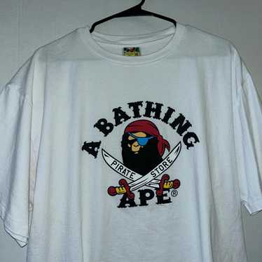 APE BAPE KAWS PIRATE STORE tシャツ ロンt XL A BATHING APExKAWS/アベイシングエイプxカウズ リバーシブル