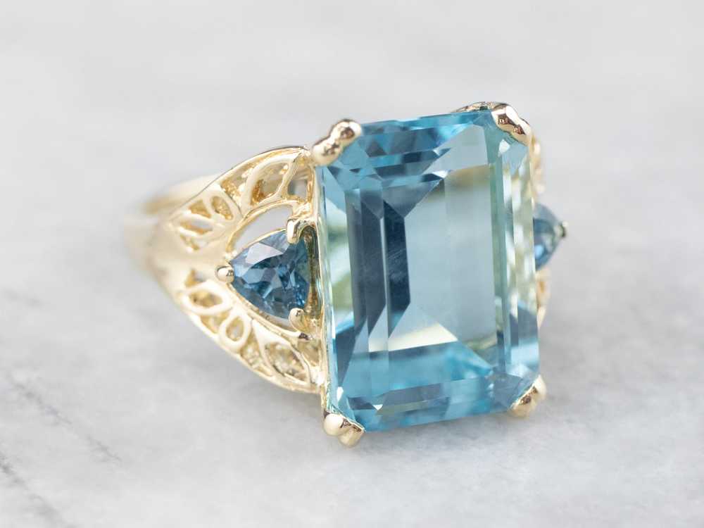Three Stone Blue Topaz Gold Cocktail Ring - image 1