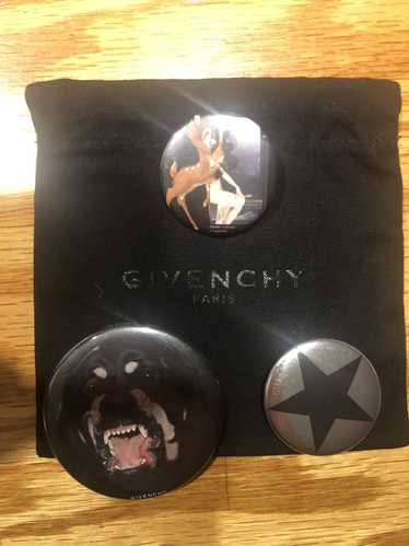 Givenchy Trio of iconic Givenchy pins with cloth d