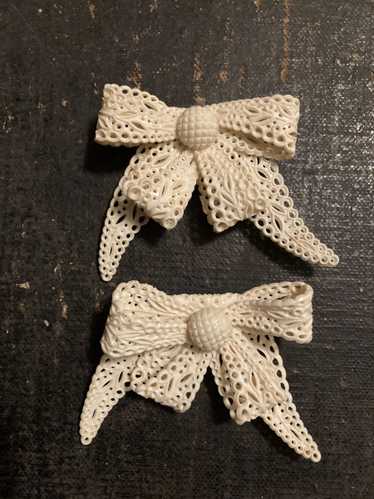 Pair of Celluloid Bow Brooches in Pierced Ivory