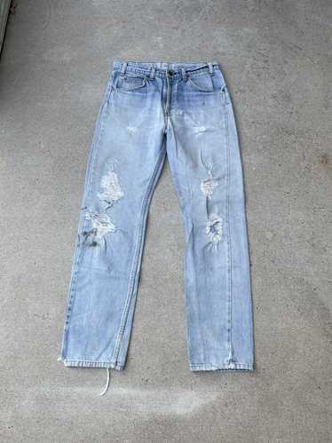 90s Levi's 560 Loose Fit Tapered Leg Ripped USA Made Light Wash Jeans  VINTAGE