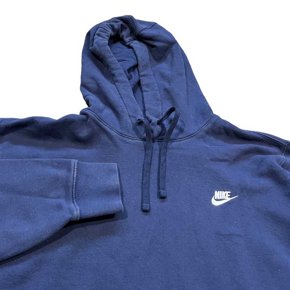 white nike hoodie with blue swoosh