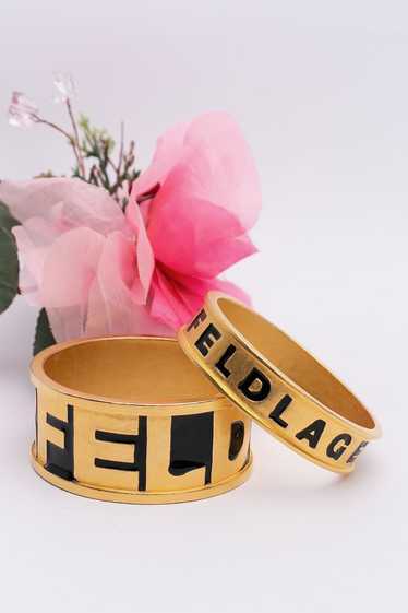 Karl Lagerfeld pair of golden bracelets - image 1