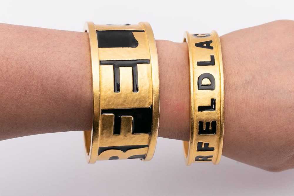 Karl Lagerfeld pair of golden bracelets - image 2