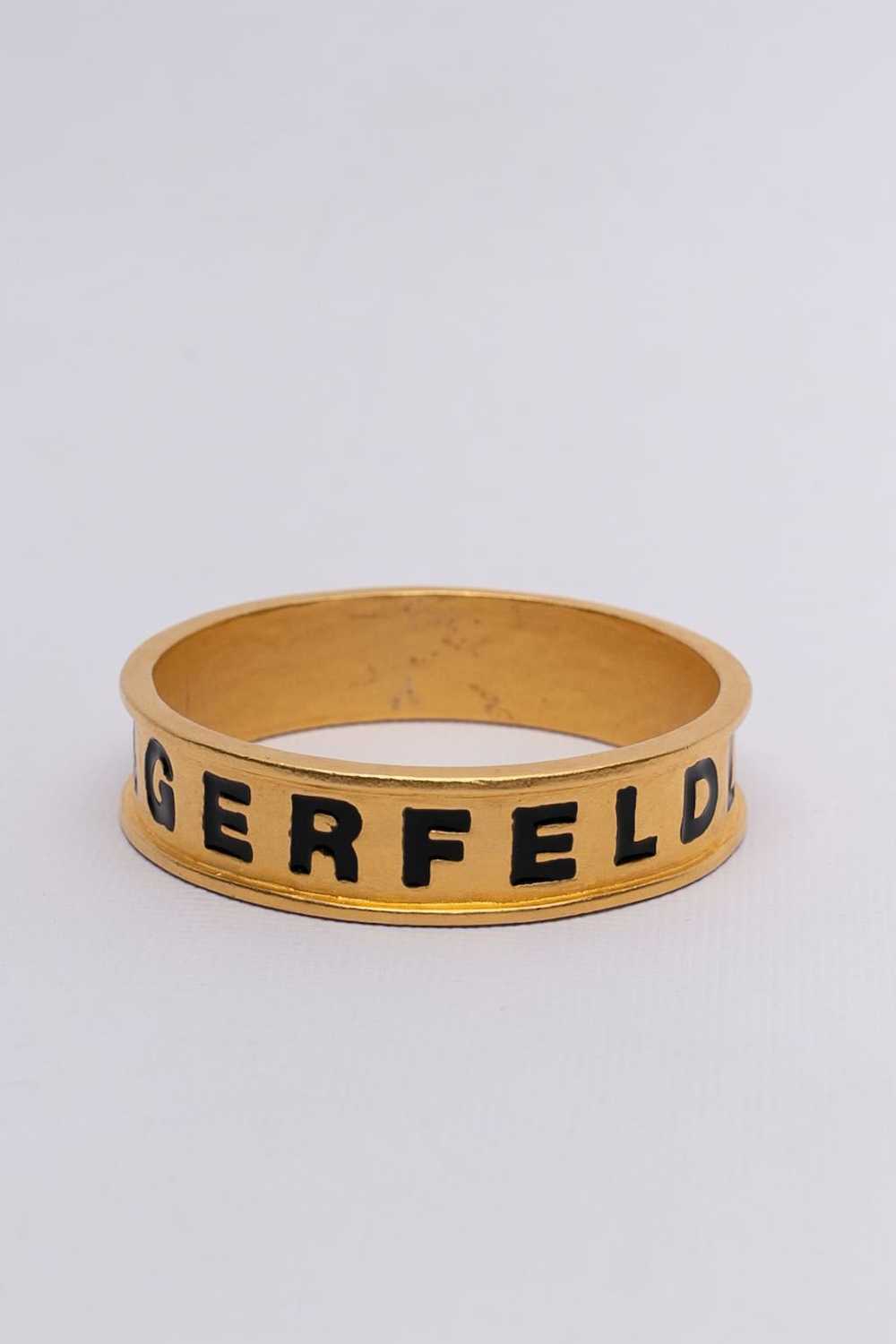 Karl Lagerfeld pair of golden bracelets - image 7