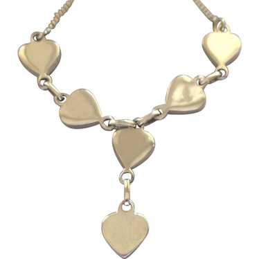 https://img.gem.app/506851926/1t/1669939486/pretty-vintage-sterling-necklace-with-hearts.jpg