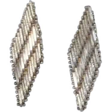 Silver Tone Slinky Pierced Earrings - image 1