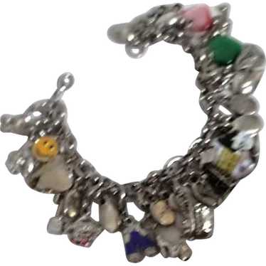 Silvertone Charm Bracelet with Many Assorted Char… - image 1