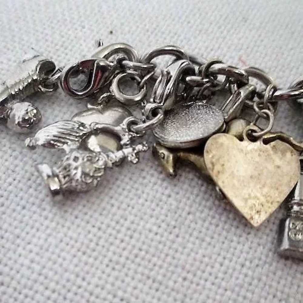 Silvertone Charm Bracelet with Many Assorted Char… - image 2