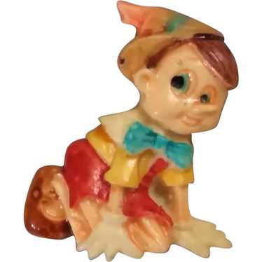 Pinocchio Celluloid Early Plastic Pin Seated Litt… - image 1