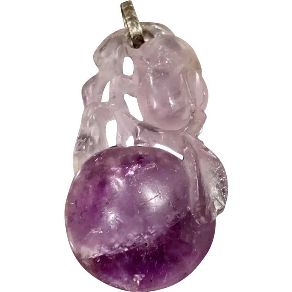 A vintage carved amethyst fruit pendant - image 1