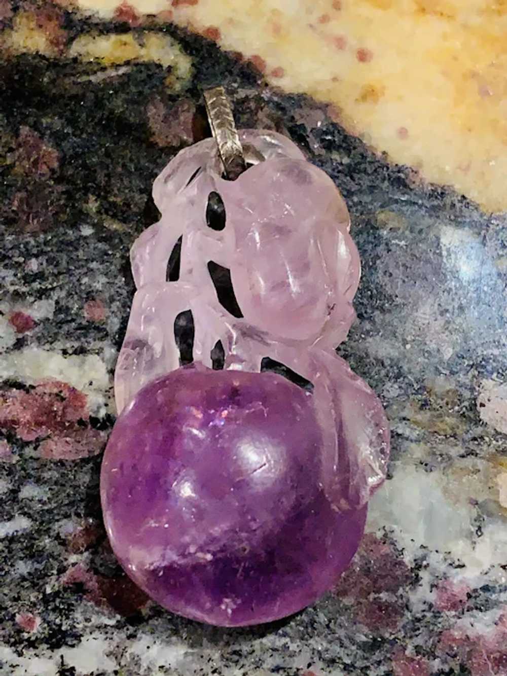 A vintage carved amethyst fruit pendant - image 2