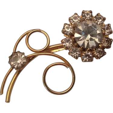 Sparkling gold tone and rhinestone flower pin
